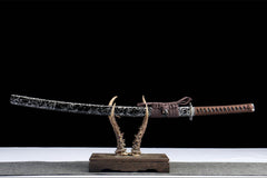 Full view of Fenchengjie Katana with curved black silver brushed blade and brown handle