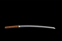 Close-up of 承影流光 blade showing the silver finish and wave temper pattern