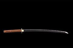 Close-up of 噬魂渊 blade showing the darkened steel finish and polished edge