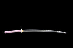 Close-up of 霓虹斩 blade showing the silver wave pattern in the 1045 steel