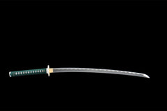 Close-up of 快意裁云 blade showing the silver wave-pattern finish in the 1045 steel