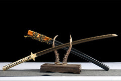 Close-up of 星陨·断时 tsuka wrap with gold diamond pattern and bamboo mekugi