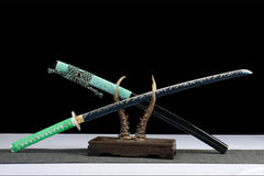 Close-up of 惊蛰 tsuka wrap with mint green cotton ito and bamboo mekugi