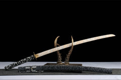 Close-up of 千机变 tsuka wrap with black-and-silver cotton ito and bamboo mekugi