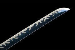 Handle and habaki detail of 惊蛰 with the openwork tsuba and dark patterned blade base