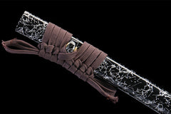 Detail of Fenchengjie Katana scabbard with brown cotton sageo knotted around copper menuki
