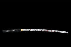 Textured close-up of 碎岳 black saya under light