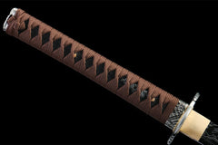 Tsuka grip detail of Fenchengjie Katana with brown cotton wrap over diamond rayskin